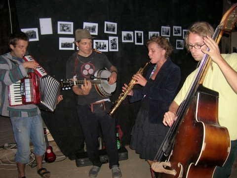Music jam session during the Theatre Village festival with Franciszek Strzeszewski's photos documenting the activities of the Other Theater School