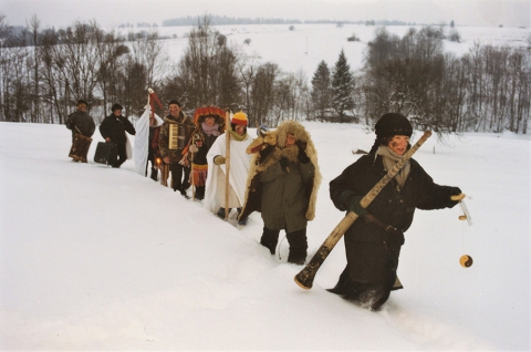Carol singers walking through the snow