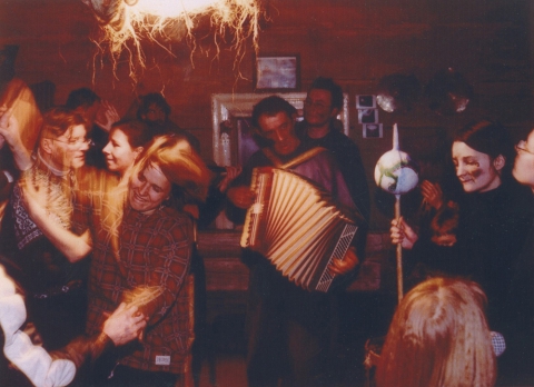 Party of carol singers and hosts