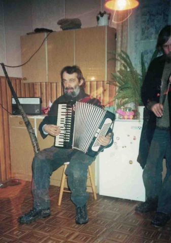 Waclaw Sobaszek playing the accordion during carol singing
