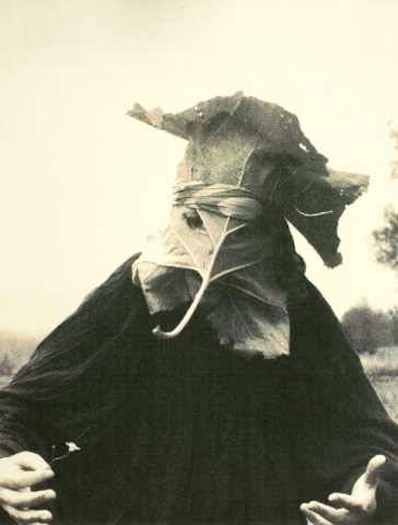 Actor in a mask made of burdock leaves from the performance "The Ghostly Shroud"