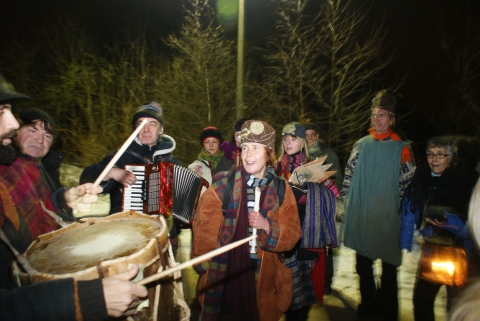 Carol singers walking through a village